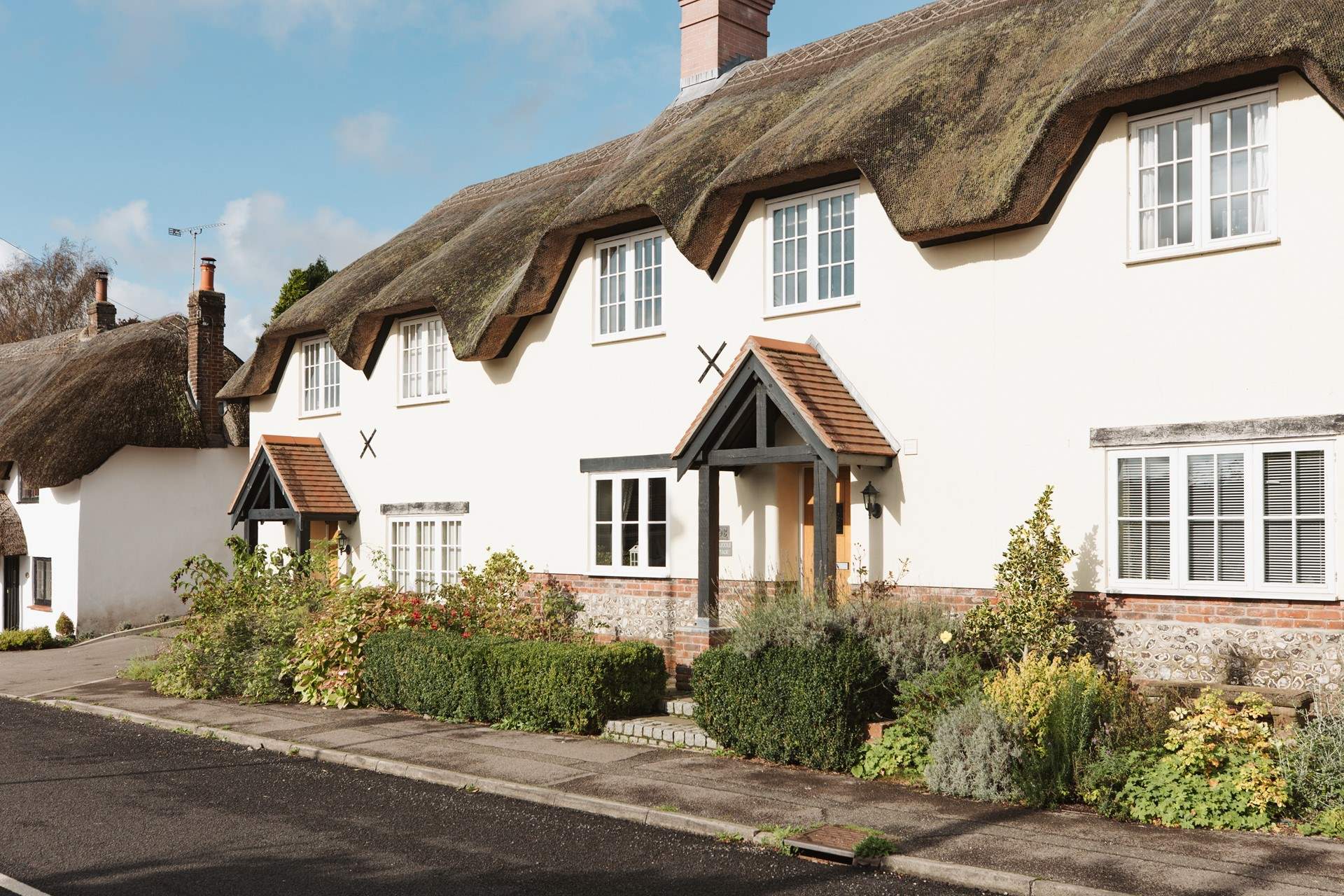 Tolpuddle is the middle cottage in the photo, the parking is behind the cottages, turn right before the white thatched cottage.
