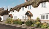 Tolpuddle is the middle cottage in the photo, the parking is behind the cottages, turn right before the white thatched cottage. - Thumbnail Image