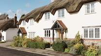 Tolpuddle is the middle cottage in the photo, the parking is behind the cottages, turn right before the white thatched cottage.