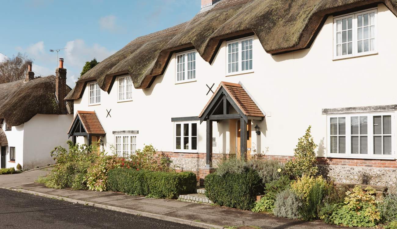 Tolpuddle is the middle cottage in the photo, the parking is behind the cottages, turn right before the white thatched cottage.