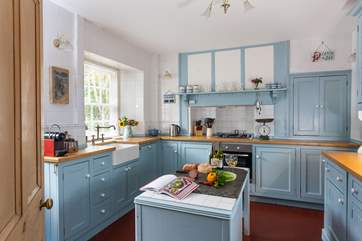 The soft blue cupboards complement the kitchen beautifully.