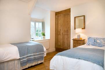 The second twin bedroom with a built in wardrobe.