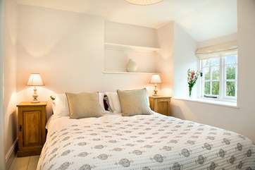 The gorgeous bedroom one has a king-size bed...
