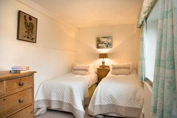 One of the twin bedrooms with draws for your belongings.
