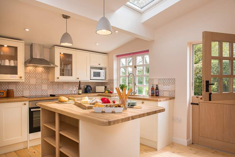 The lovely cottage kitchen is wonderfully light and airy.