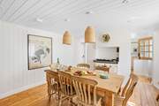 This social room dinning area links through to the kitchen.