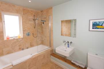 The light and modern family bathroom.