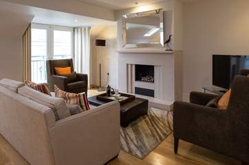 Looking into the tastefully decorated living area on entrance to the first floor living-area.