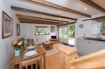 French doors lead out to the lovely lawned garden.