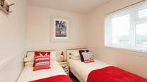 The cosy twin room has views out to the peaceful  nature reserve.