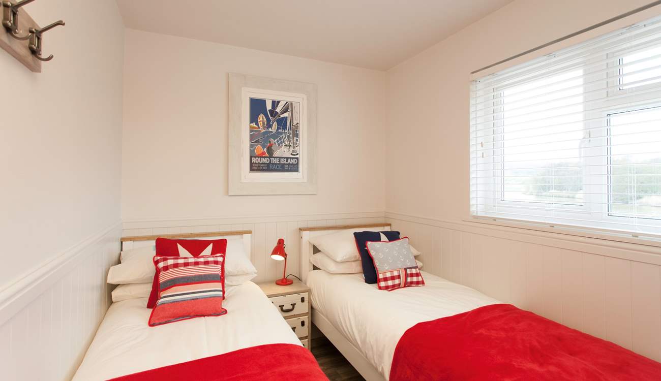 The cosy twin room has views out to the peaceful  nature reserve.