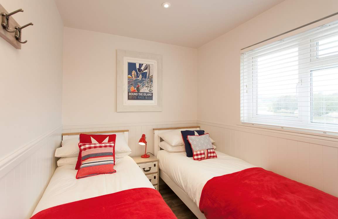 The cosy twin room has views out to the peaceful  nature reserve.