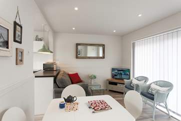 Cosy up on the sofa, or open the French doors out to the decking on a warm summer's day.