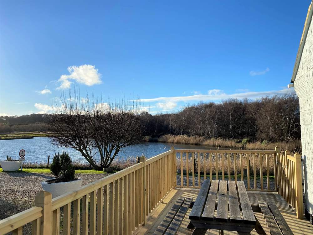 A lovely enclosed decking area to the side of Hove To.