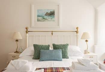 Crisp white linen with colourful cushions and throws and fluffy white towels make for a very comfortable stay.