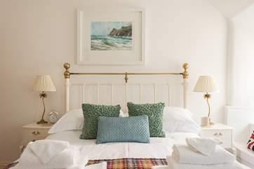 Crisp white linen with colourful cushions and throws and fluffy white towels make for a very comfortable stay.