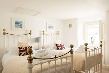 Solid metal beds with comfy mattresses ready to sink into after a day out exploring.