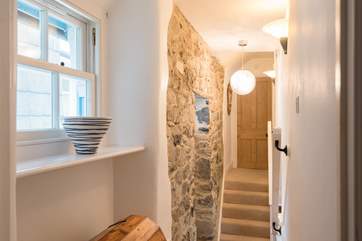 The hallway between the bedrooms with the bathroom at the end of the landing.