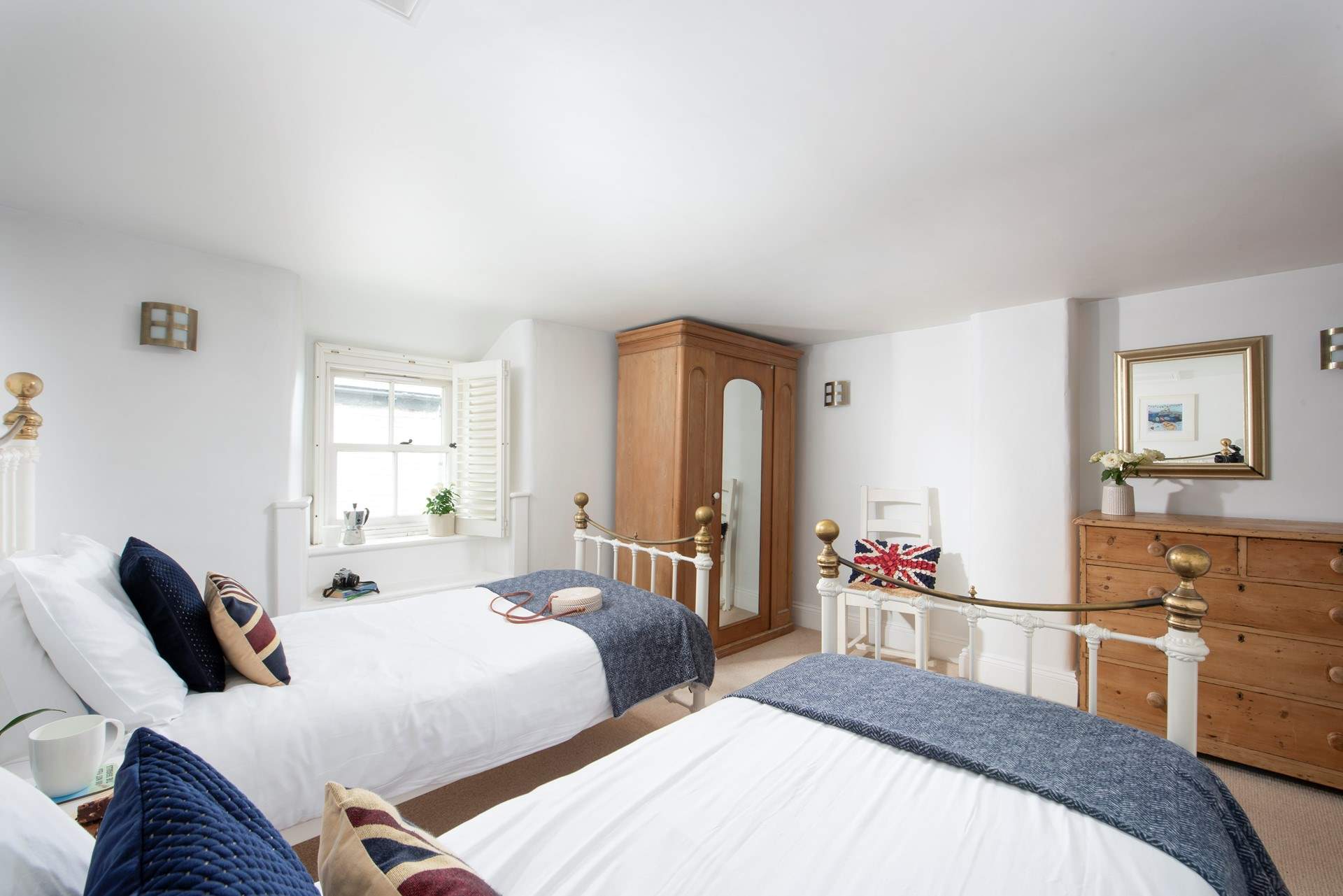 Soft linens paired with sea views in the laid-back twin room.