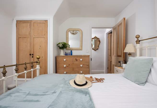 Bedroom 1 with king-size bed and views down to the harbour.