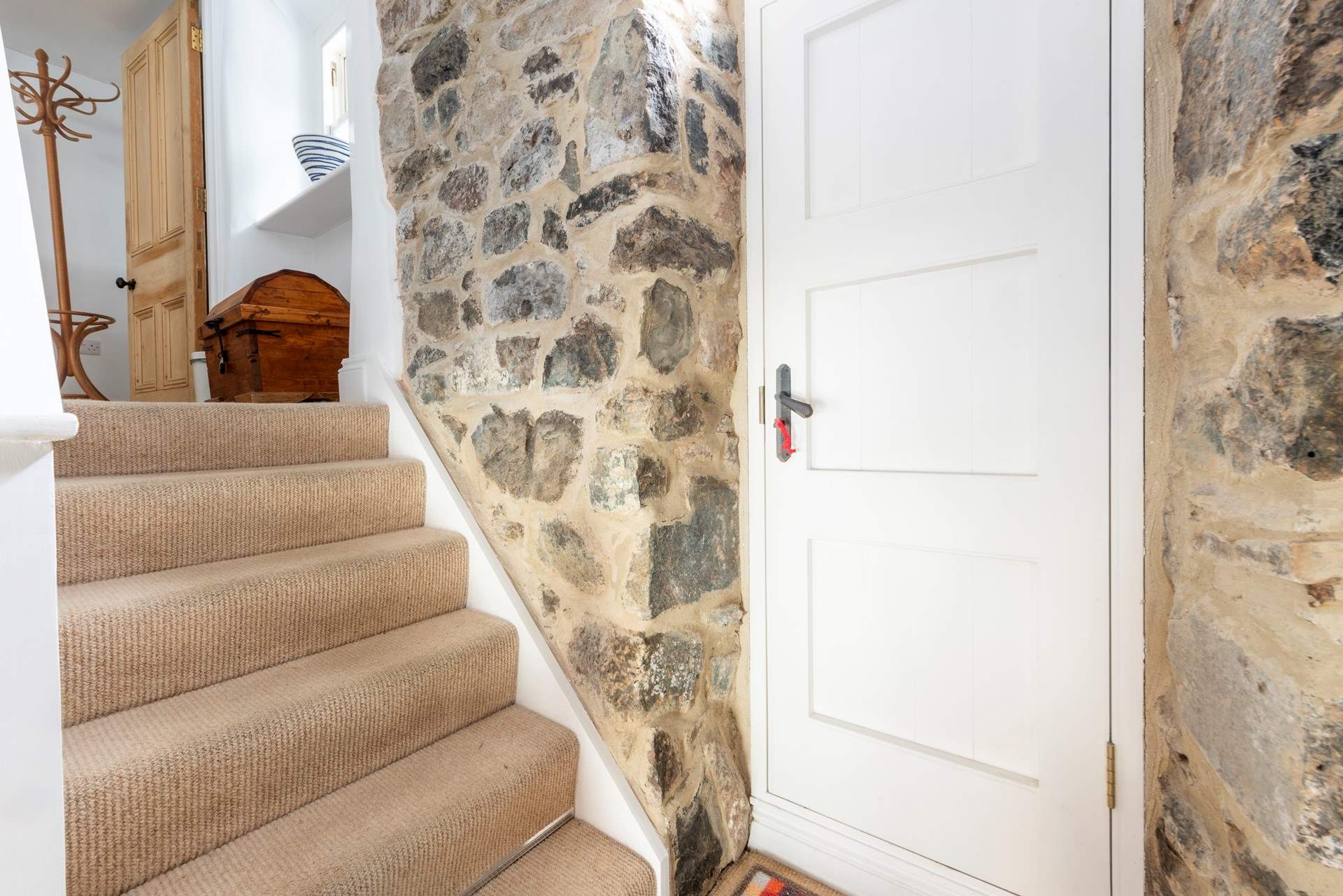 Exposed Cornish granite at the back of the cottage.