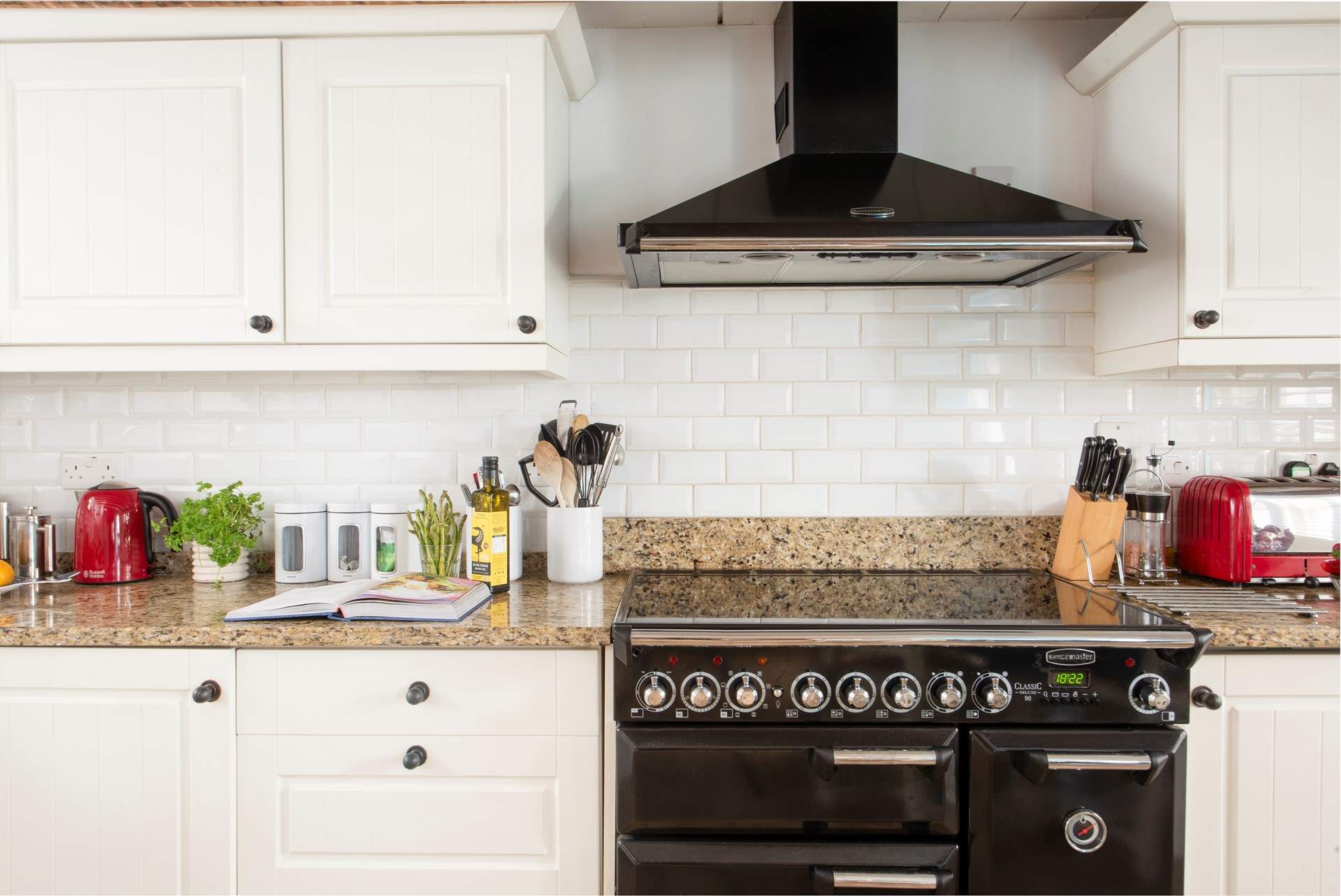The cottage core kitchen is beautifully equipped.