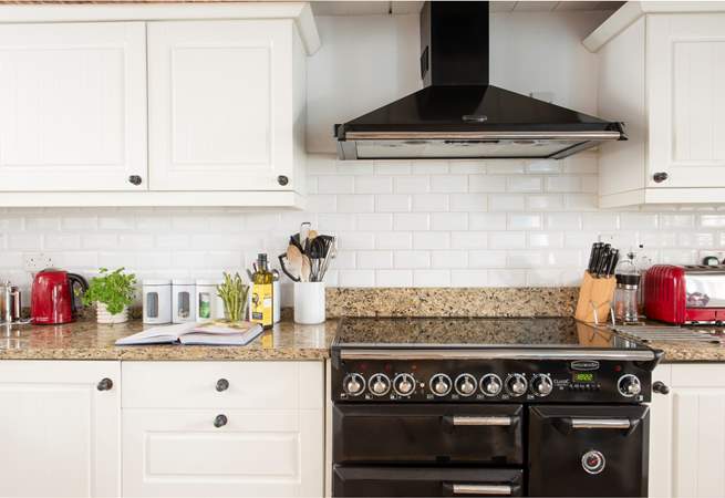 The cottage core kitchen is beautifully equipped.
