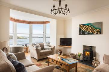 The lovely sitting-room faces the water.