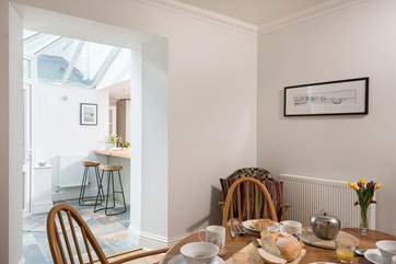 An open archway from the dining-room into the kitchen/breakfast-room.