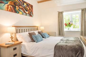 The cottage has two pretty bedrooms.