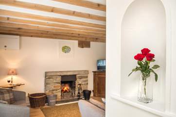 The open fire is a welcome sight on chillier nights, making this a great retreat all year round.