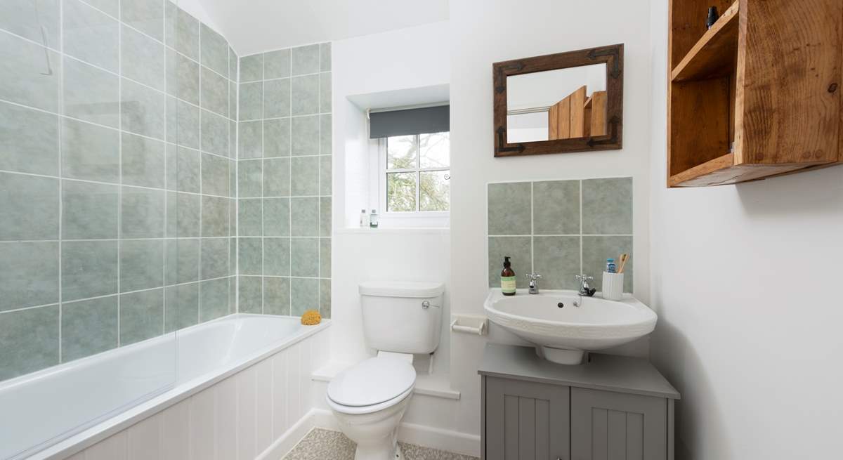 The family bathroom has a fitted shower over the bath.