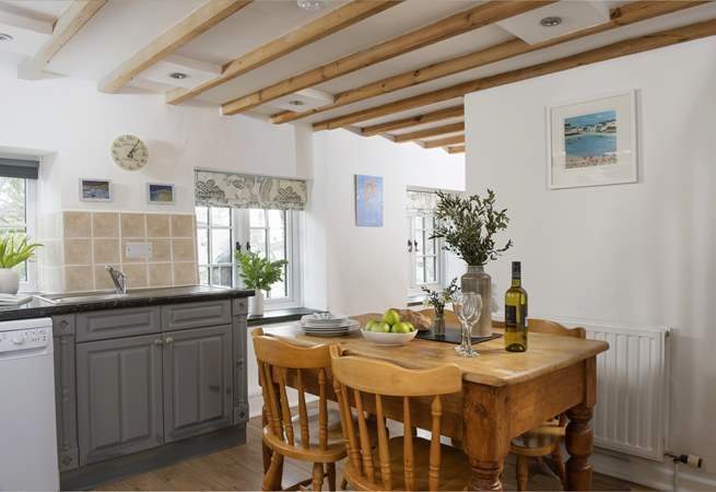The pretty country style kitchen dining room.