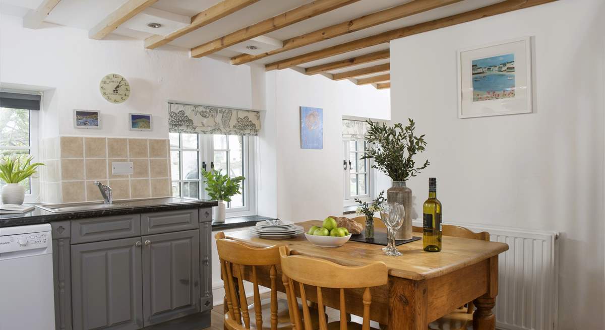 The pretty country style kitchen dining room.