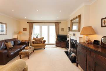 The cosy living room has plenty of comfortable seating and is a lovely space to relax