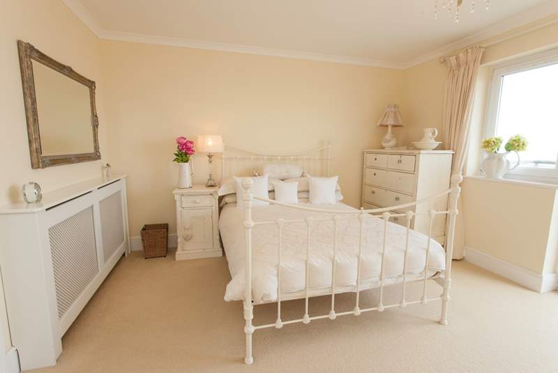 The double bedroom on the first floor has patio doors out to a balcony with stunning views over the solent