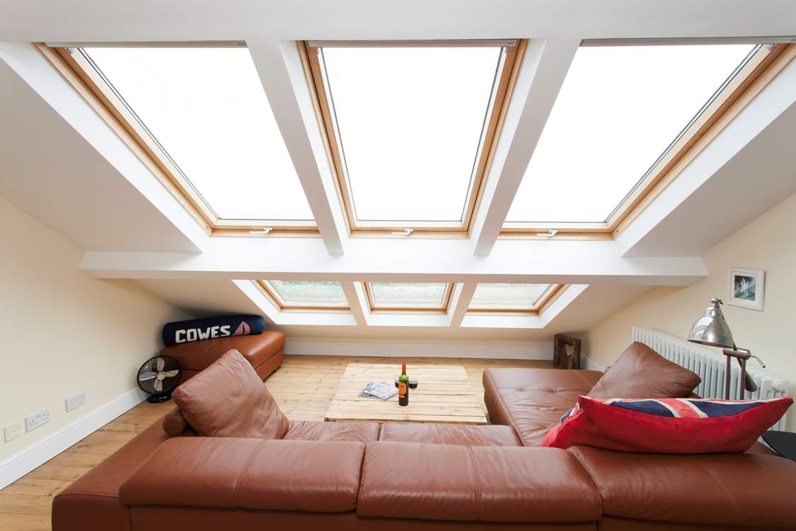 Grab a glass of wine, cuddle up on the sofa and watch the ships sail by, the waves crash up on the beach and the view of Portsmouth beyond the sea out of the stunning picture window (restricted head height).