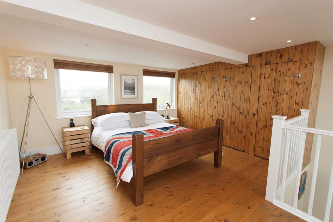 The principal bedroom has a king-size bed to spread out, snuggle under the covers and get a good night's sleep in.