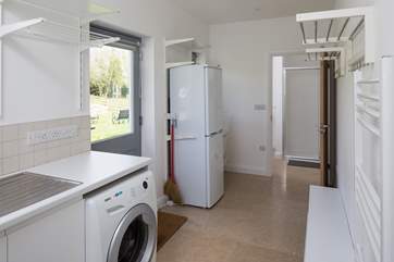 Large utility-room. Perfect for storing all those boots, bags and coats. Leading into a separate WC, with a large shower cubicle.