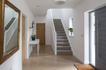 Grand entrance hall leading to the first floor, the downstairs bedroom, utility-room and straight on into the living areas. What a nice welcome!