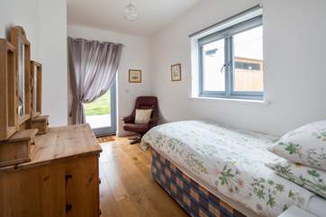 The single ground floor bedroom is a lovely place to escape with a good book.