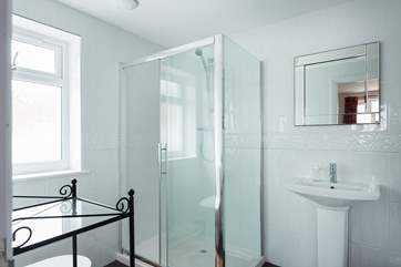 This spacious shower-room is en suite to Bedroom 6.