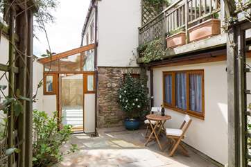 Step off the High Street, down a secret passage and burst through the door into this magical patio belonging to Harmony Cottage. What an exciting way to start your holiday.