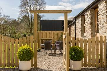 A lovely welcome awaits through the archway!