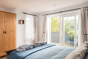 The bedroom is on the ground floor of the cottage.