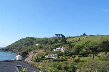 The coastal footpath can just be seen climbing up the hill, where it turns back onto the clifftop at the top.