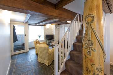 An ancient column guards the stairs.