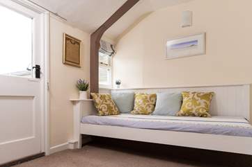 The roof terrace is accessed from the snug and has limited views over roof tops towards the harbour.