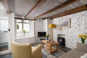 The electric wood-burner effect fire will keep you warm throughout the year.