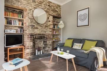 The exposed stone wall adds a touch of history to this old estate house.